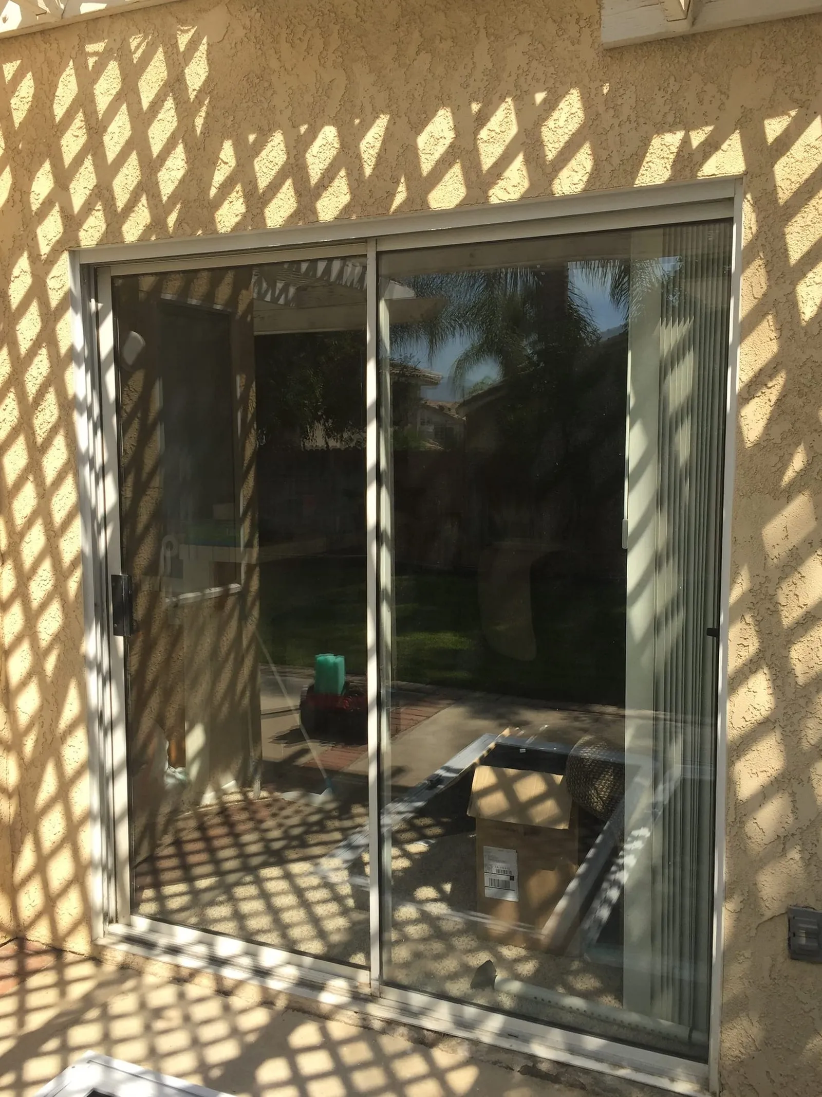 A patio slider with bare glass, before the sliding security screen was installed